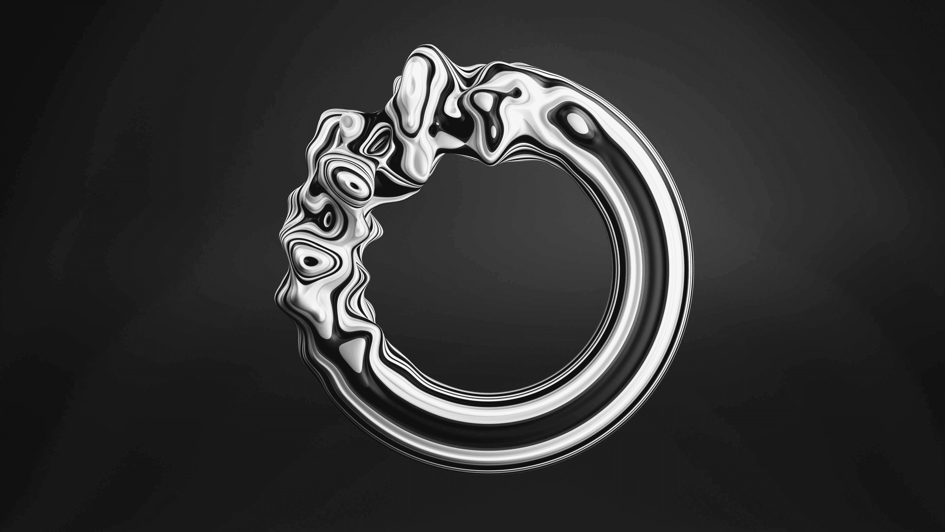 Black and white image of people working at a table with laptops, showing hands gesturing during discussion of digital content displayed on screens, with fabrica® logo in the corner.