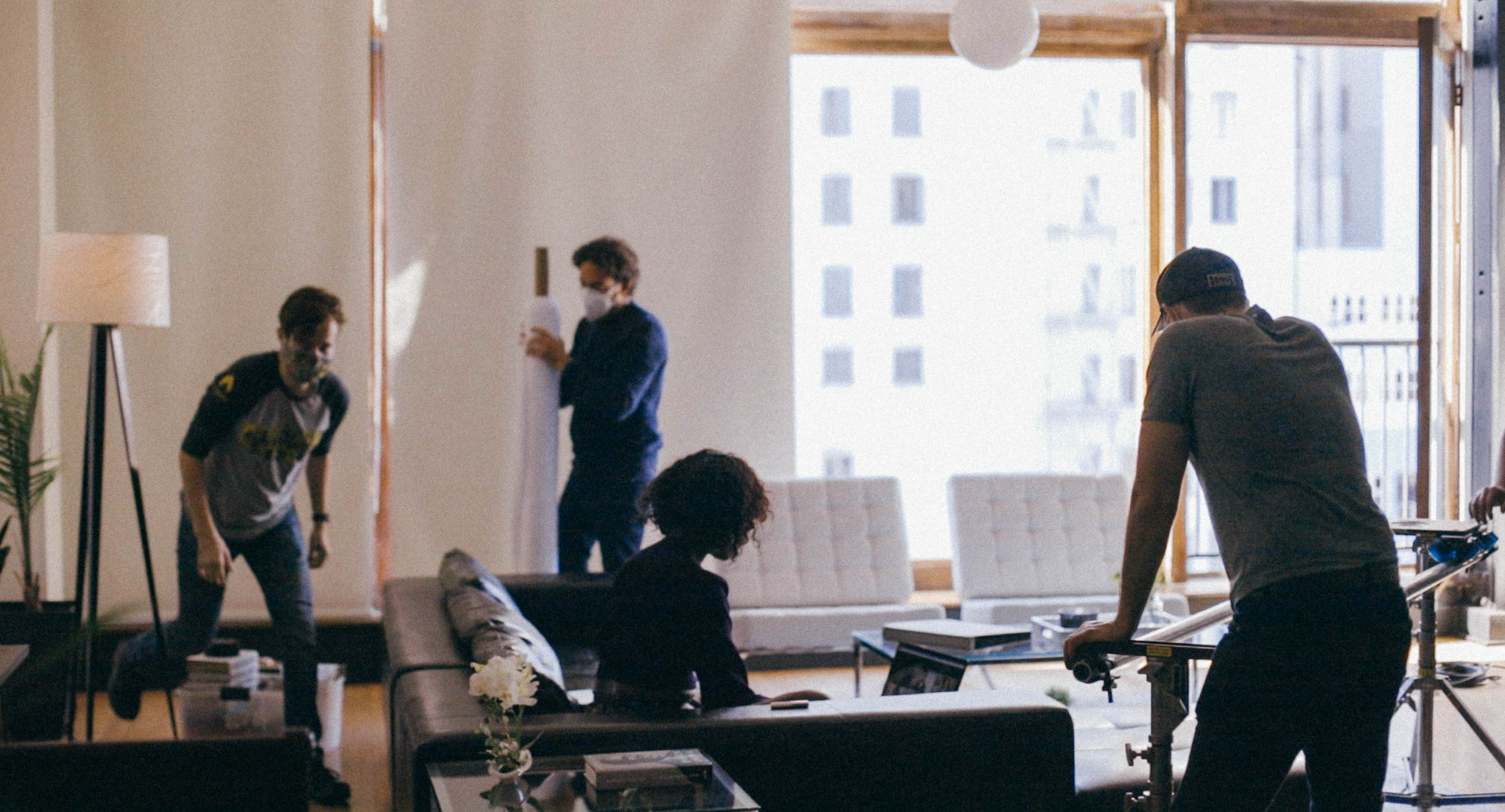 Crew members (Michael Esptein, DJ Kurs, and Cooper Ulrich), moving equipment and objects while Natasha Ofili as Amara/Sade is preparing for the next scene.