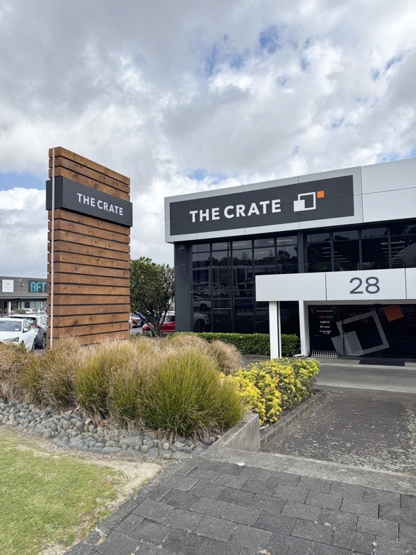 View from footpath on Constellation Drive, looking at The Crate Albany-Rosedale signage and building frontage.