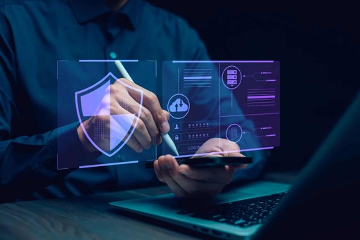 Security professional conducting compliance audit on laptop, nDataStor PCI-DSS HIPAA testing