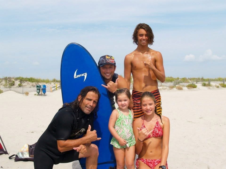 Surfer cleaning Surf board