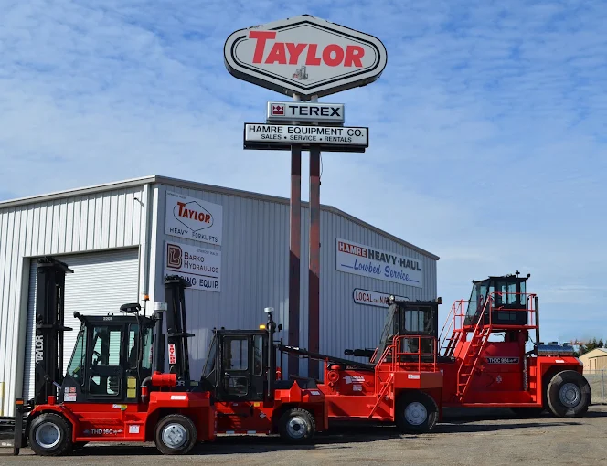 Taylor dealer sign above the Hamre Equipment Co. building with red Taylor machines out front