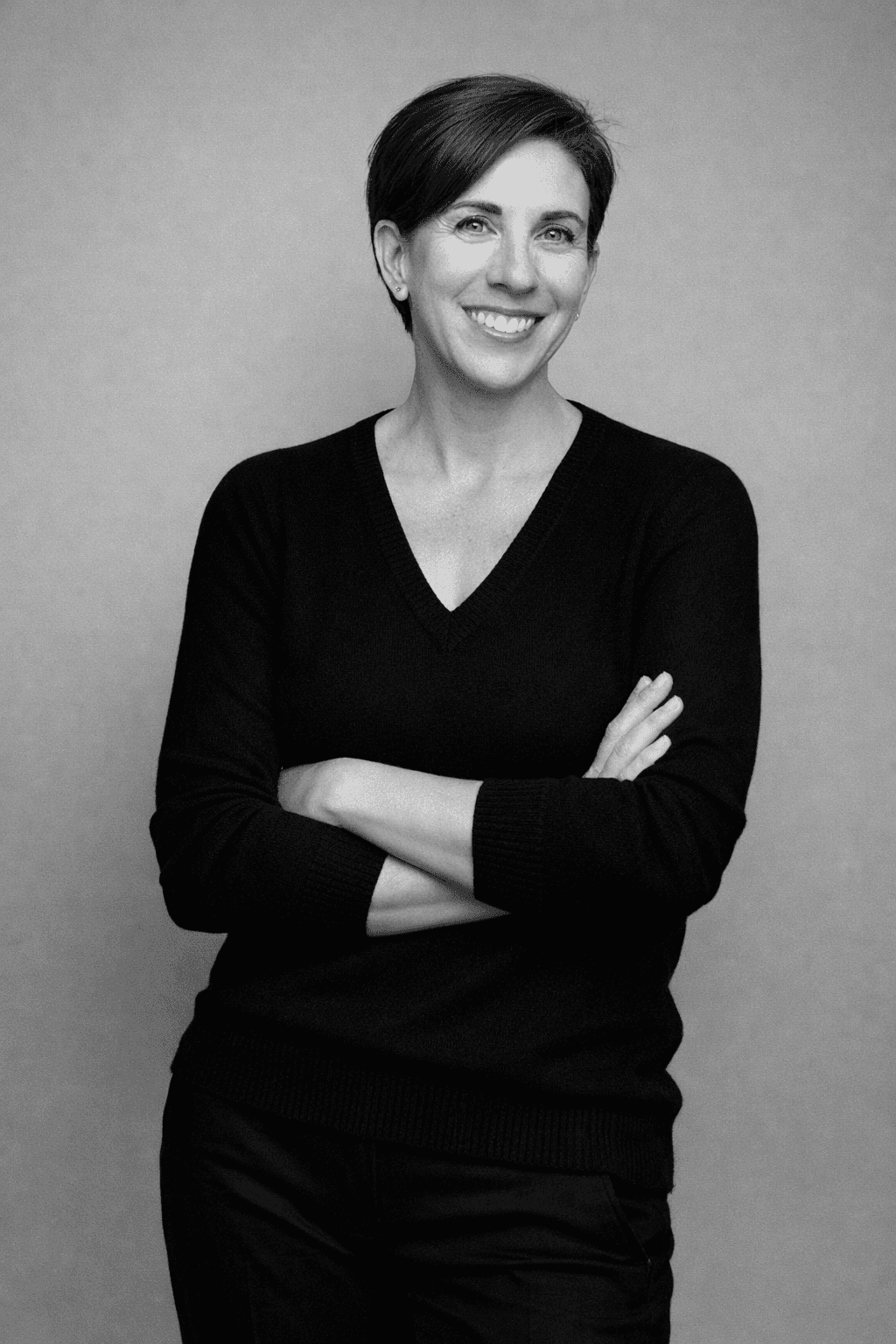 A warm-toned blurred office meeting scene.