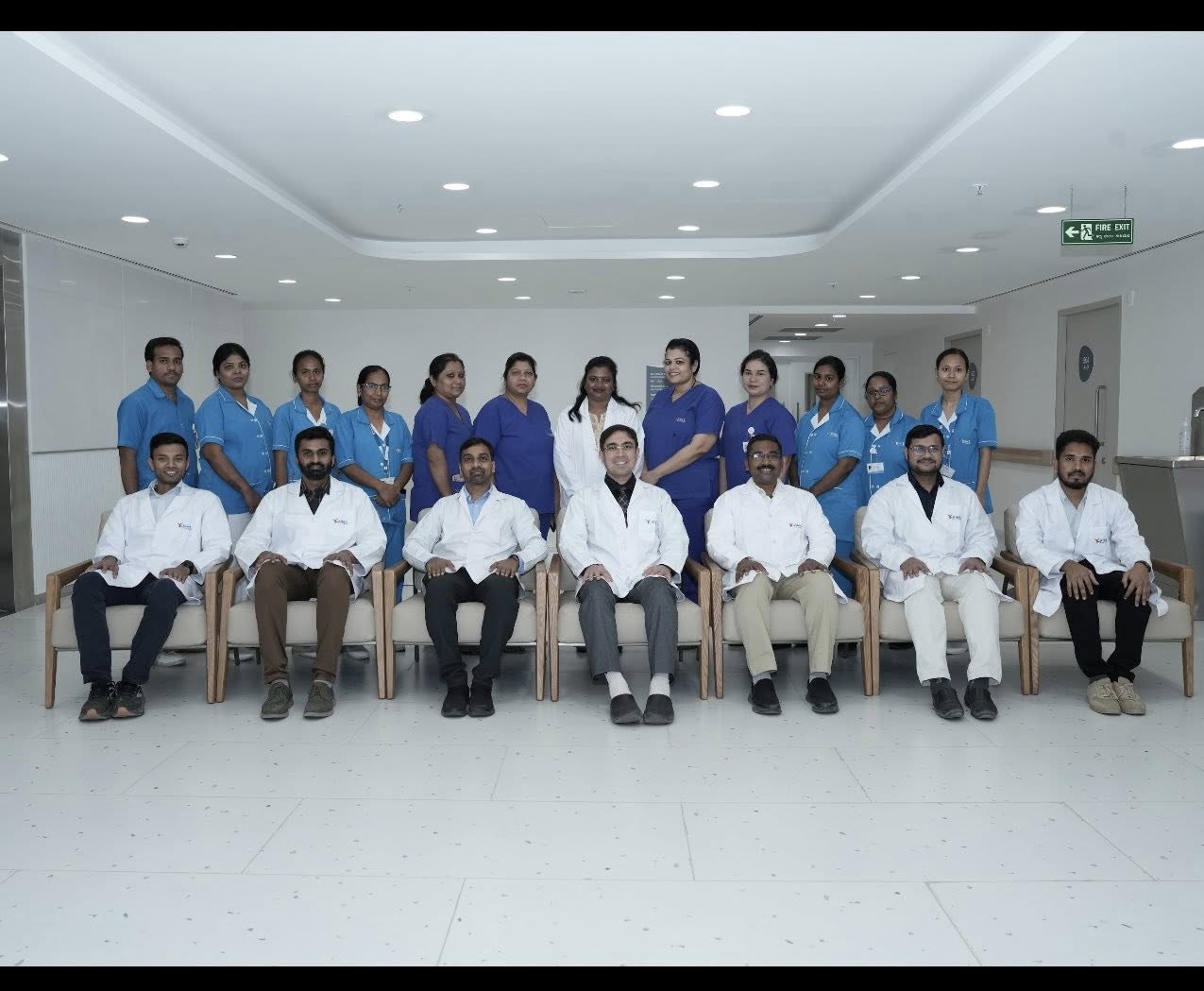 A large, dark futuristic spaceship flying over a glowing city at sunset