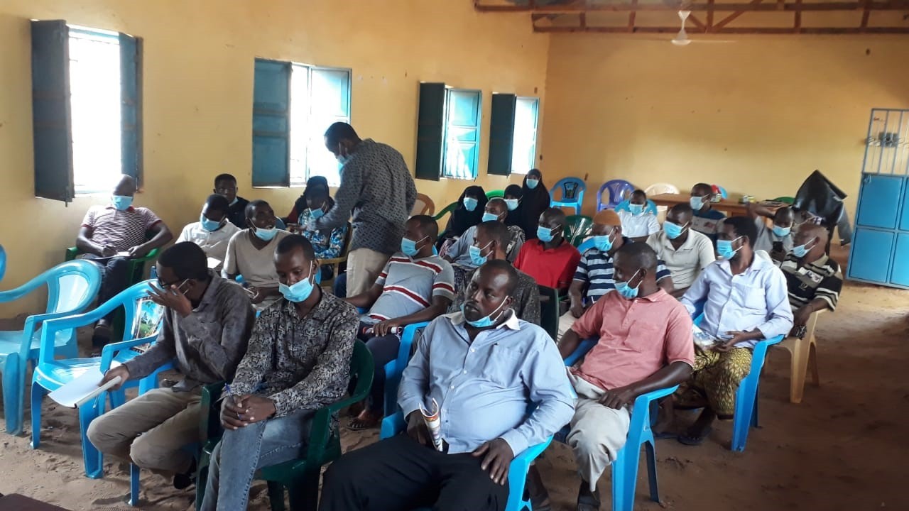 woman in gray hijab and gray coat