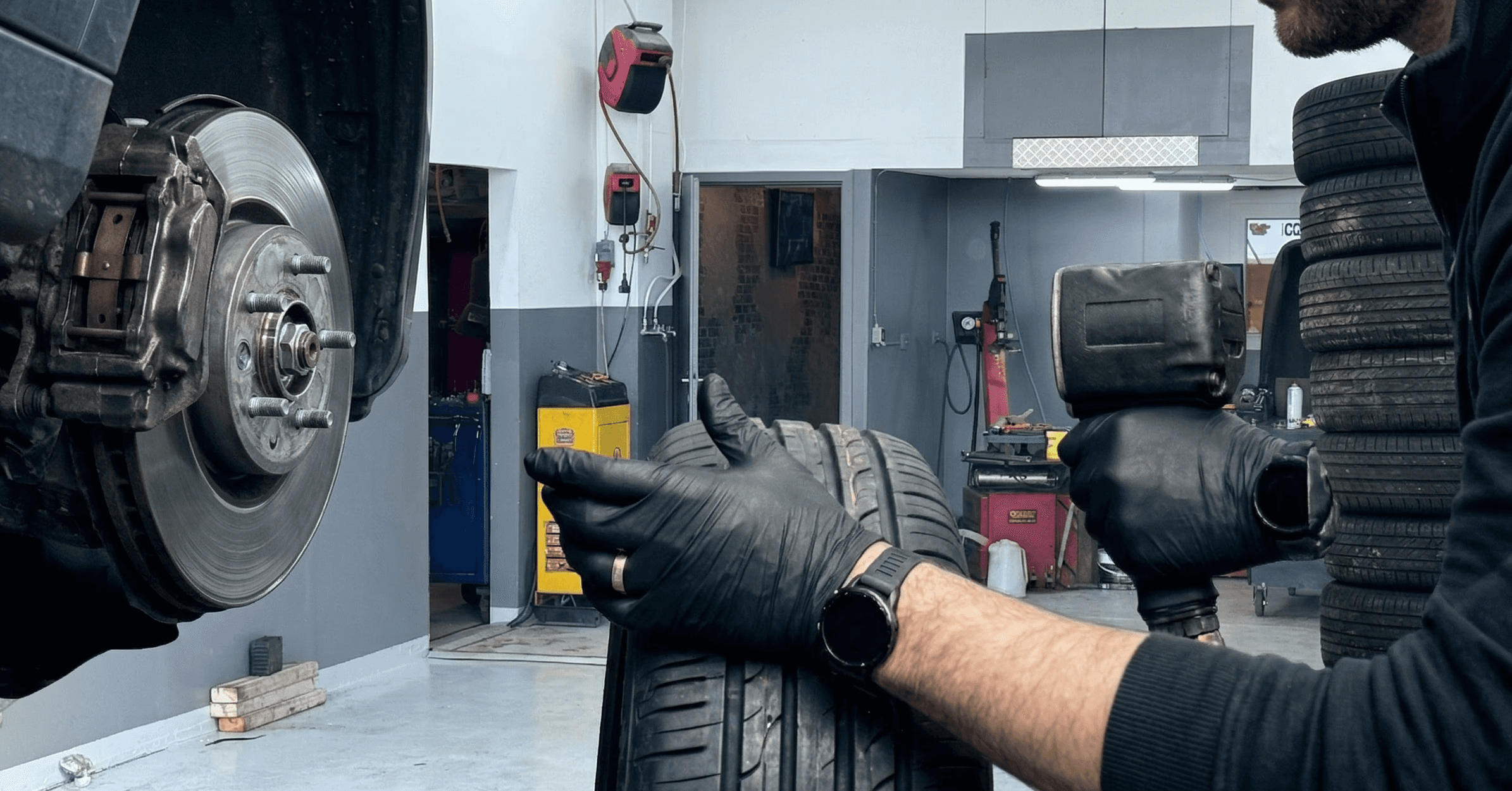 a garage filled with lots of different colored cars