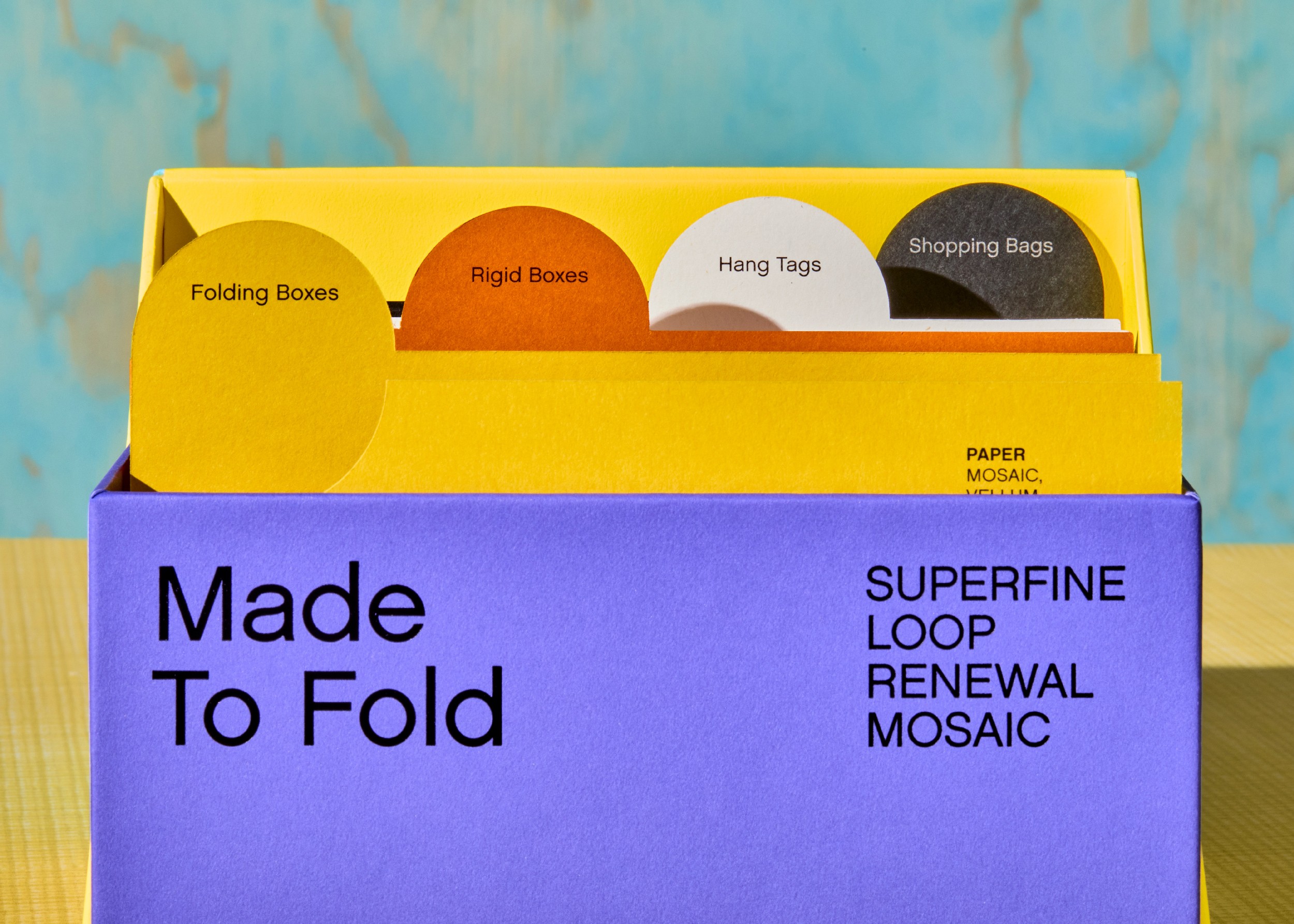 Streetside billboard with flyposters of the Batch.Works brand and illustrations