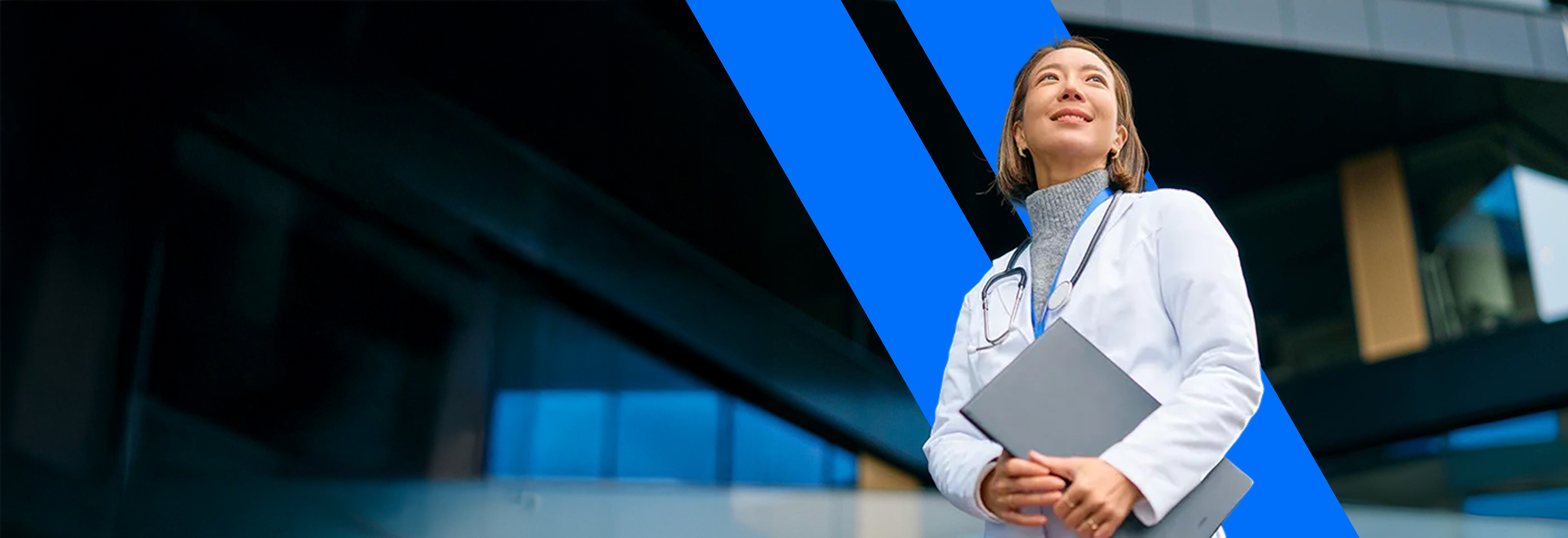 person sitting on grass and using phone