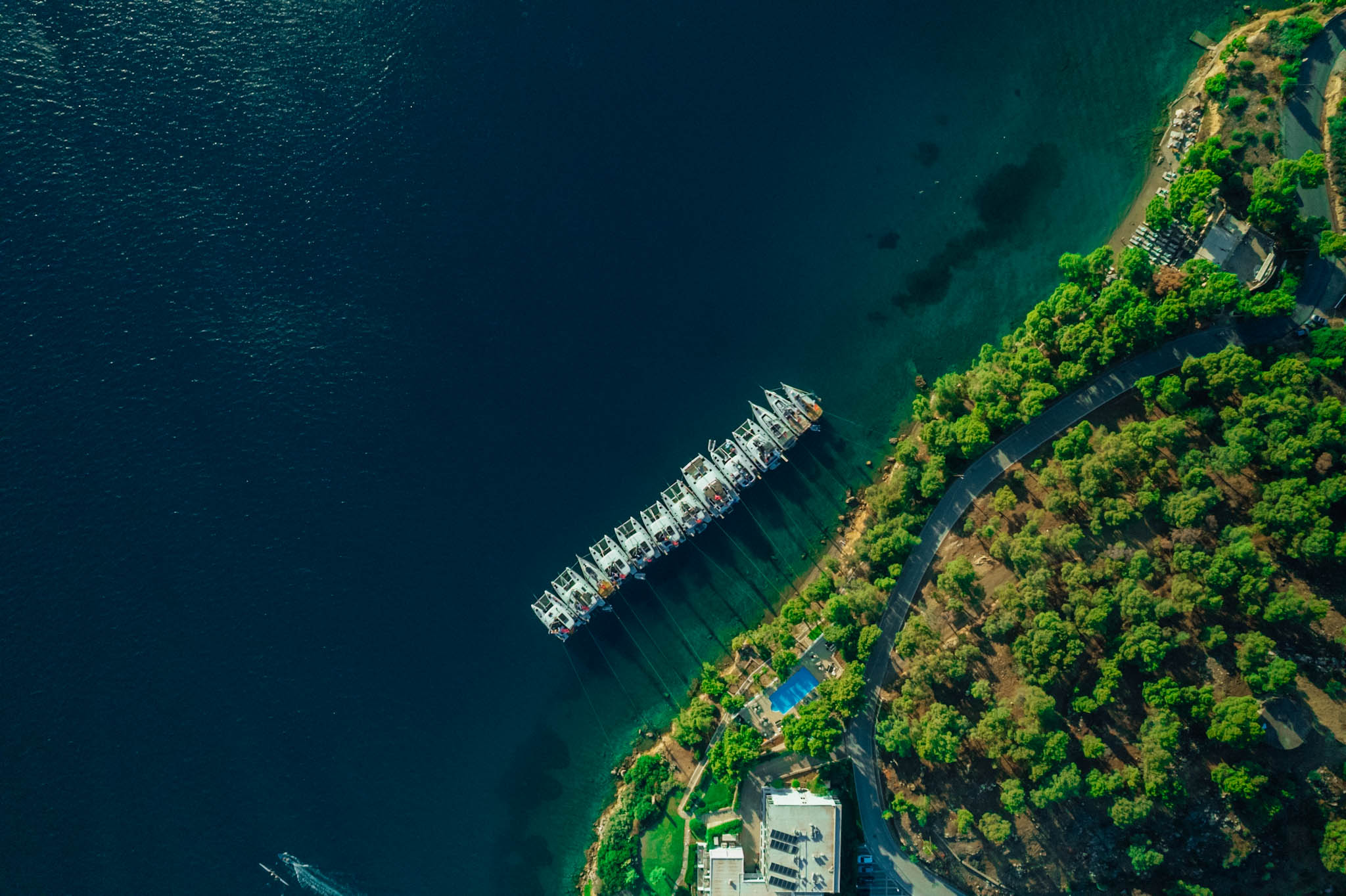 drone shot of the yacht week from Greece all lined up in a line raft