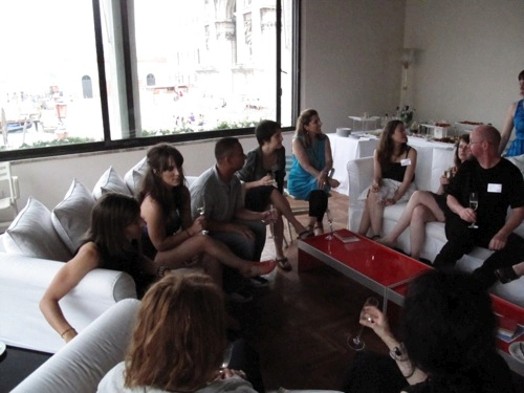 group of students sitting in circle with wine