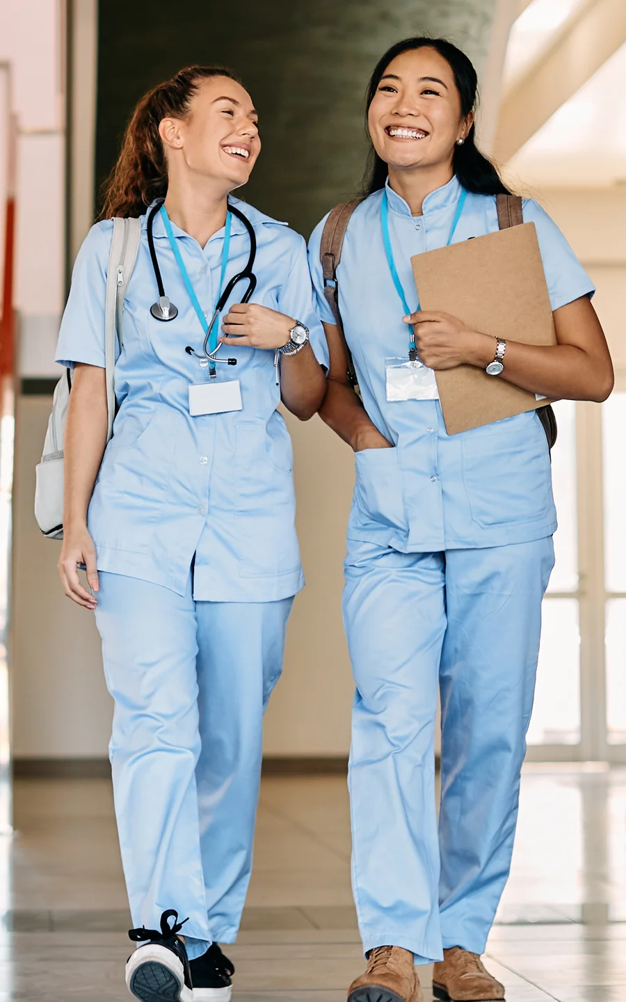 Doctor and Filipino nurse reviewing chart.