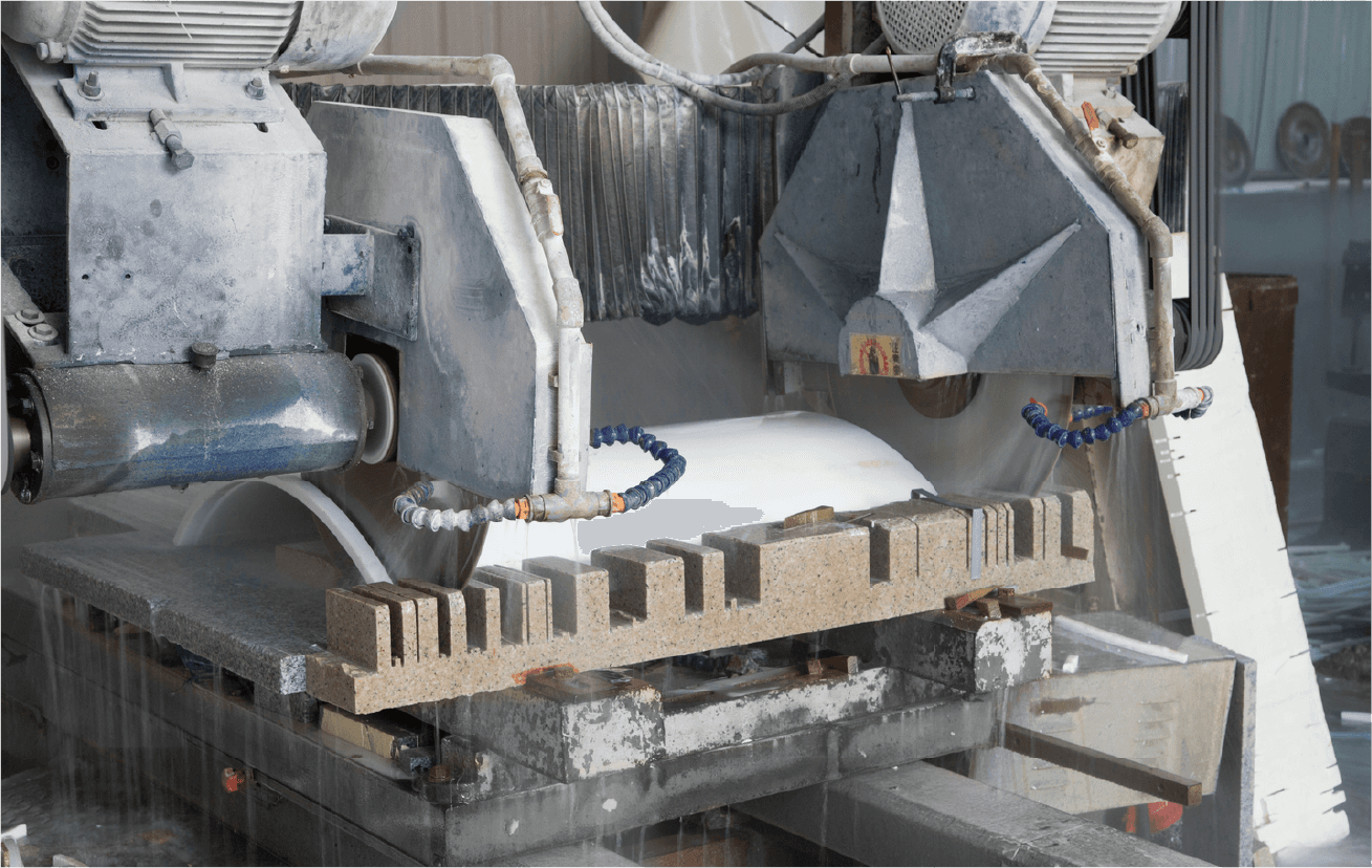 Close-up view of the trimming blades of the Automatic Arc-Slab Trimming Machine, illustrating the machine's engineering and precise cutting capability.