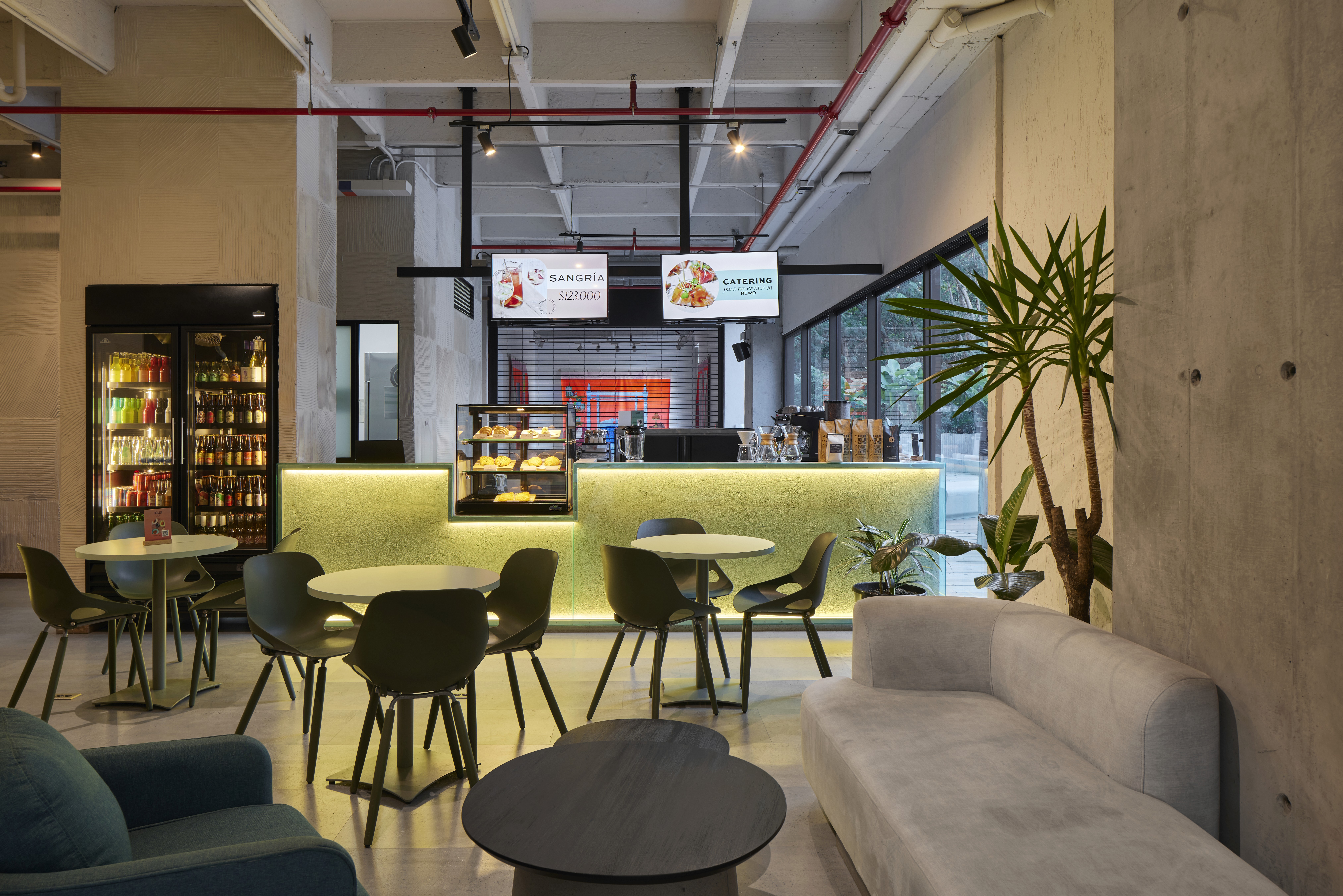 Double-height interior with flowing sculptural forms and warm raking light