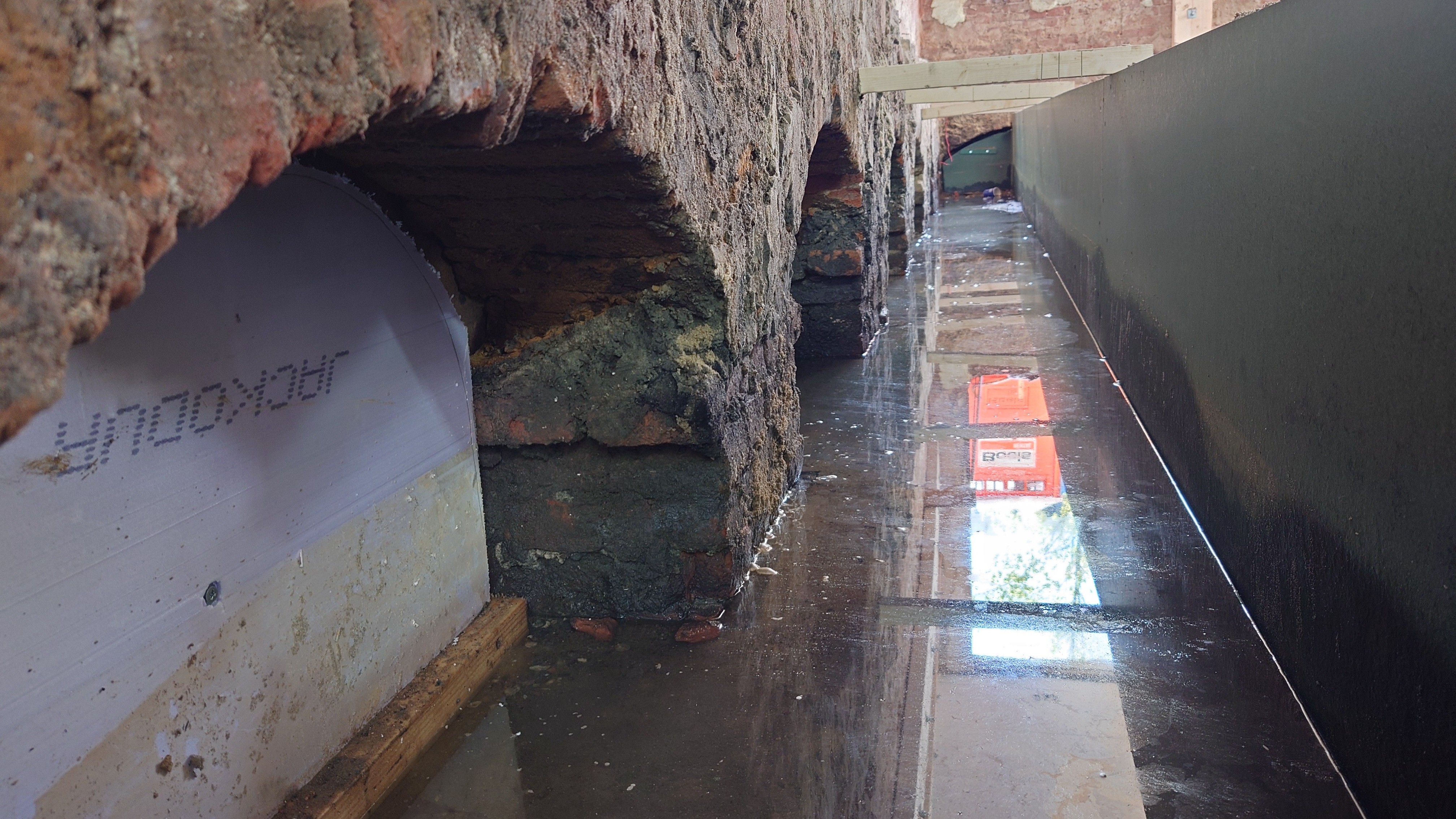 white wooden shelf near white wall