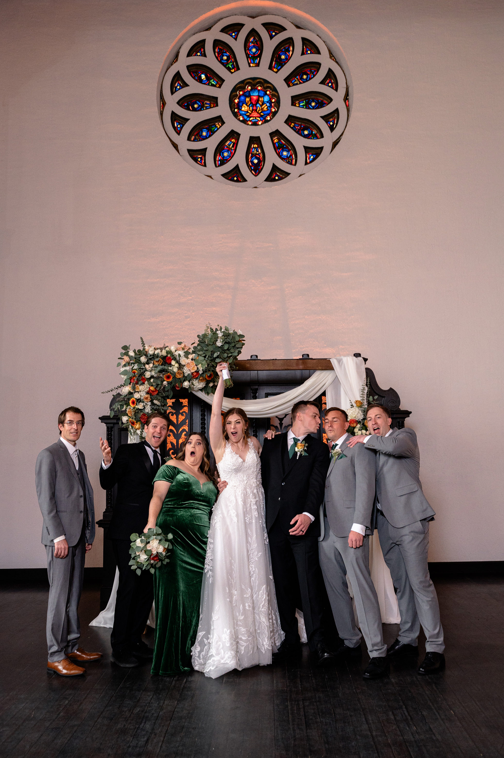 Flat lay wedding details with bouquet, rings, and sparkling bridal heels