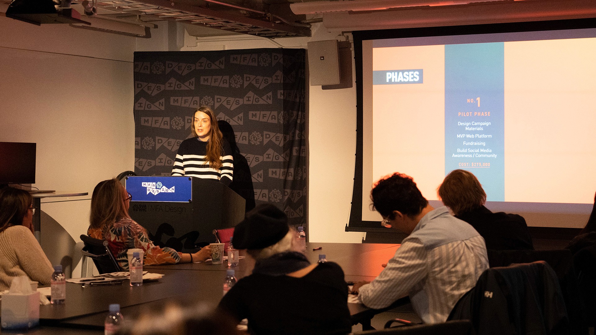 a student giving a presentation from a podium