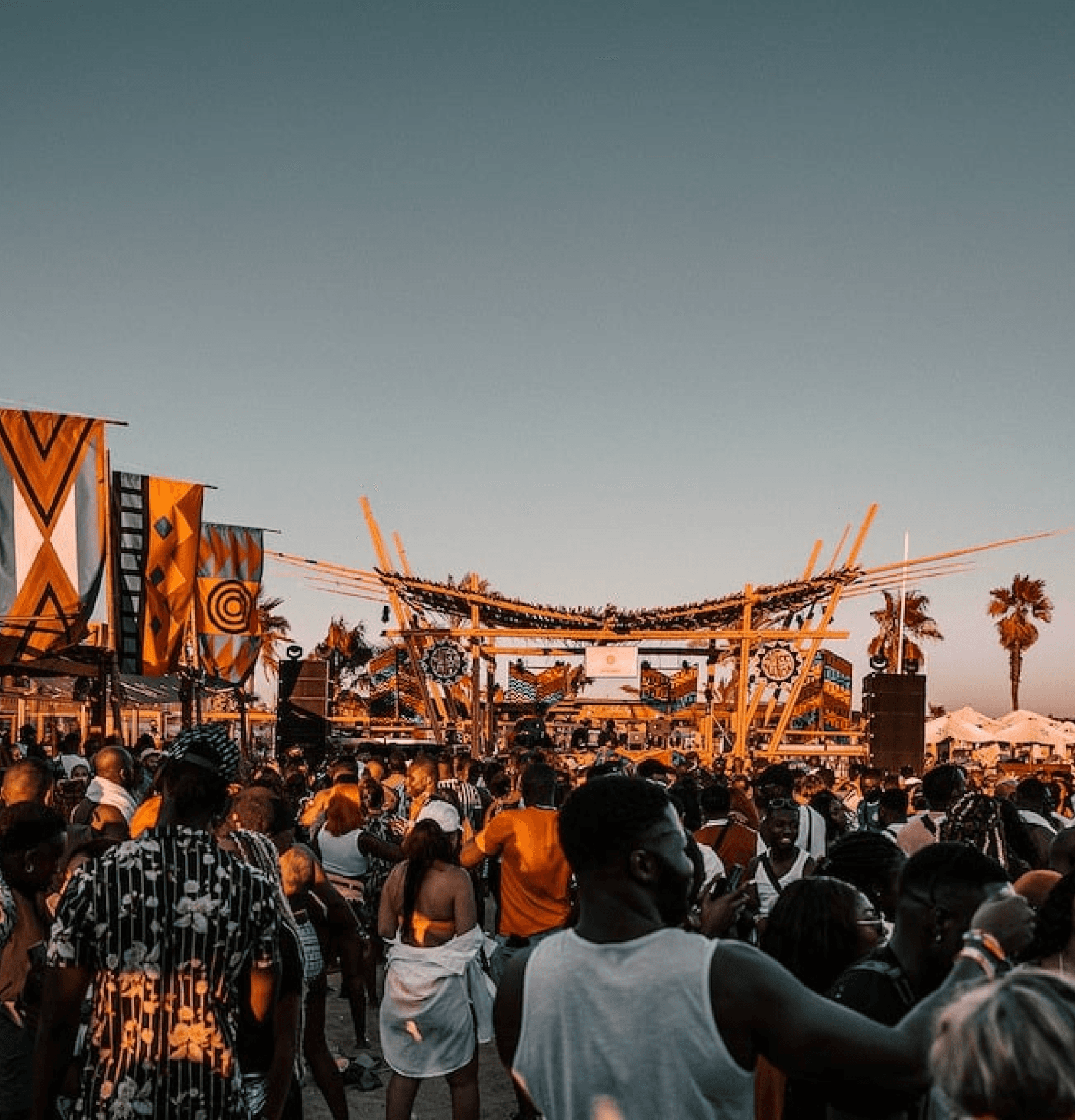 A festive outdoor event with a colorful stage design and leopard-print accents for a brand activation.