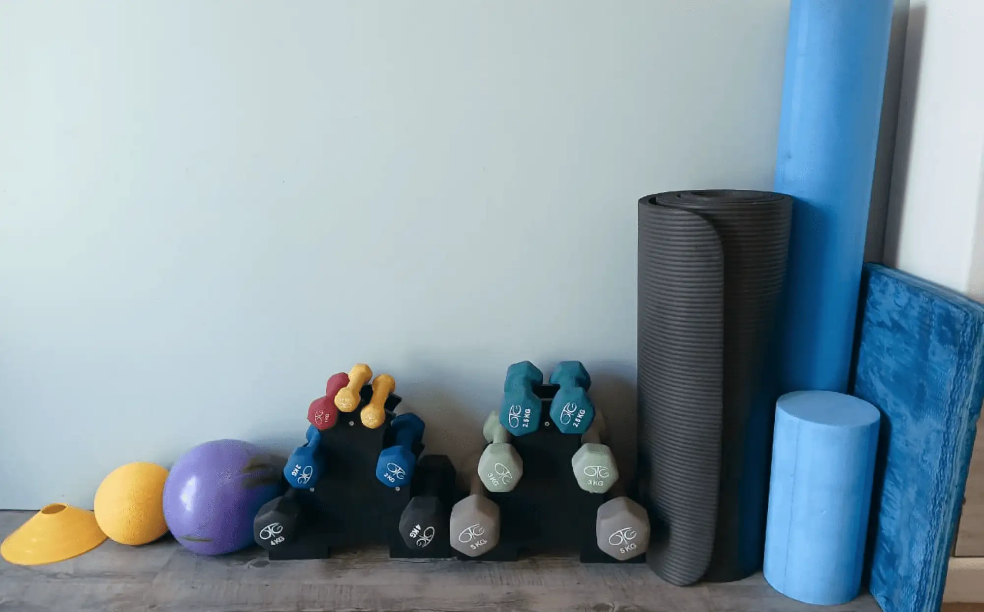 Various clinic exercise equipment ranging from free weights to foam rollers and exercise balls