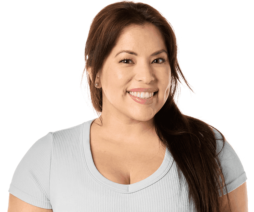 A smiling man wearing a green button-up shirt.