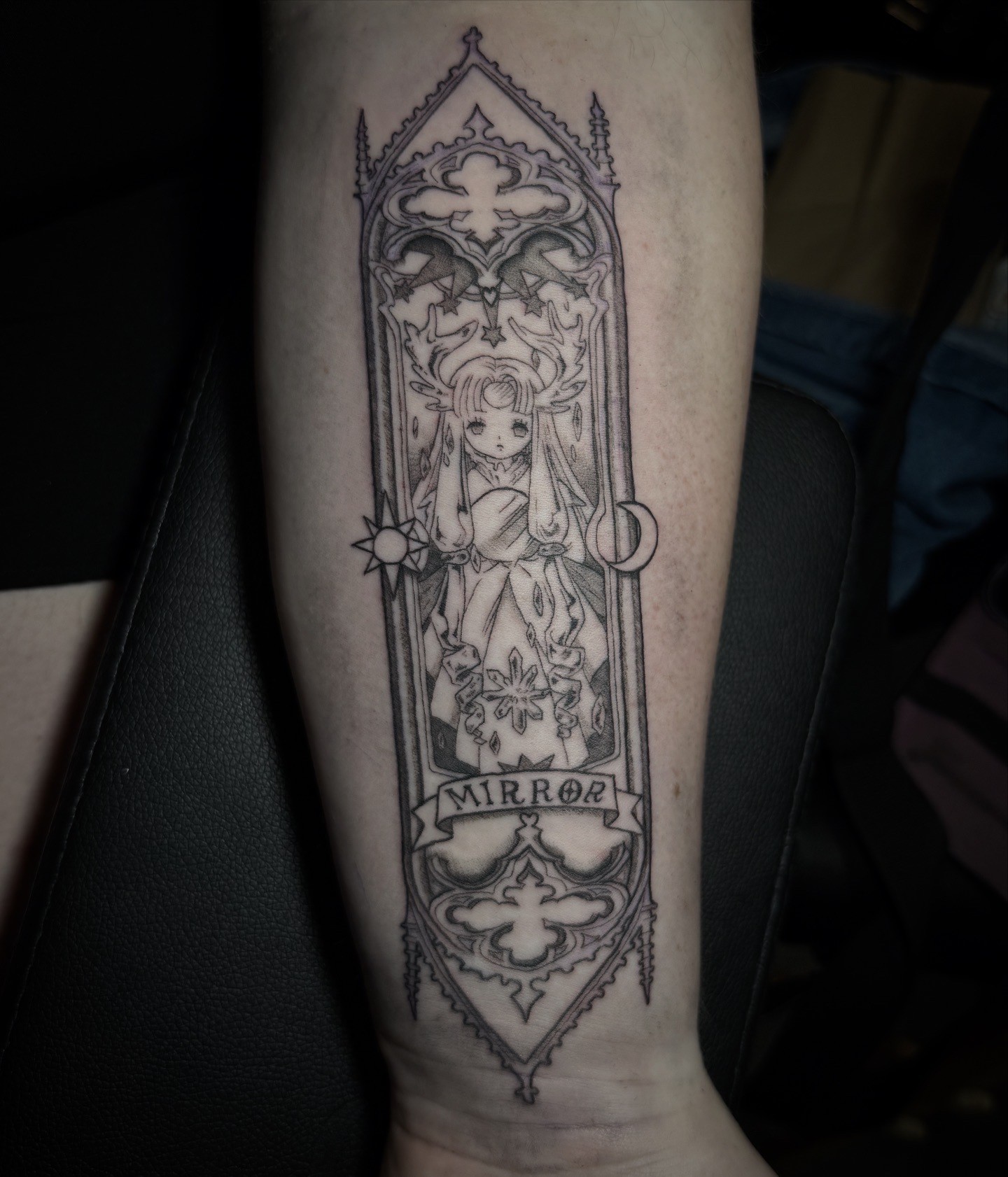 Black and grey tattoo on a leg depicting Alucard and Seras Victoria from the anime series Hellsing.
