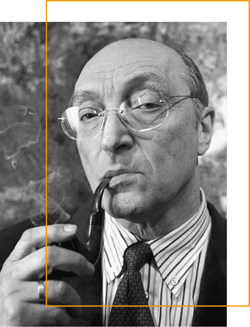 Black-and-white photograph of an older man with glasses, partially bald with short hair on the sides. He wears a striped shirt, patterned tie, and dark jacket. Holding a smoking pipe close to his mouth, wisps of smoke visible. The image is used as part of the brand imagery for Kozakov Foundation, designed by House of Five Studio.