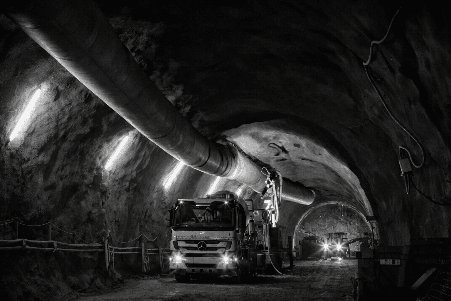 yellow and black truck on road near mountain during daytime