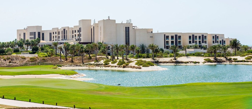 The golf course at the Royal Oasis Golf Resort in Abu Dhabi, located in Hidd Al Saadiyat, features lush greens and scenic views.