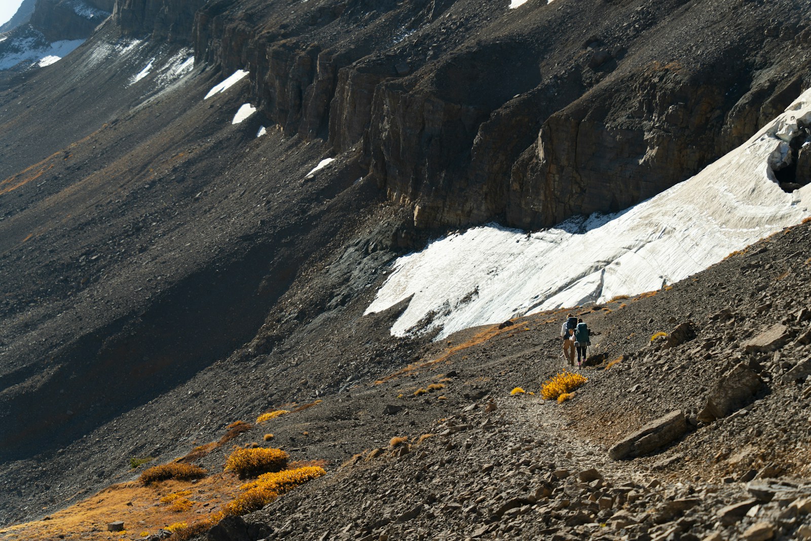 Lone hiker on a rocky mountain trail