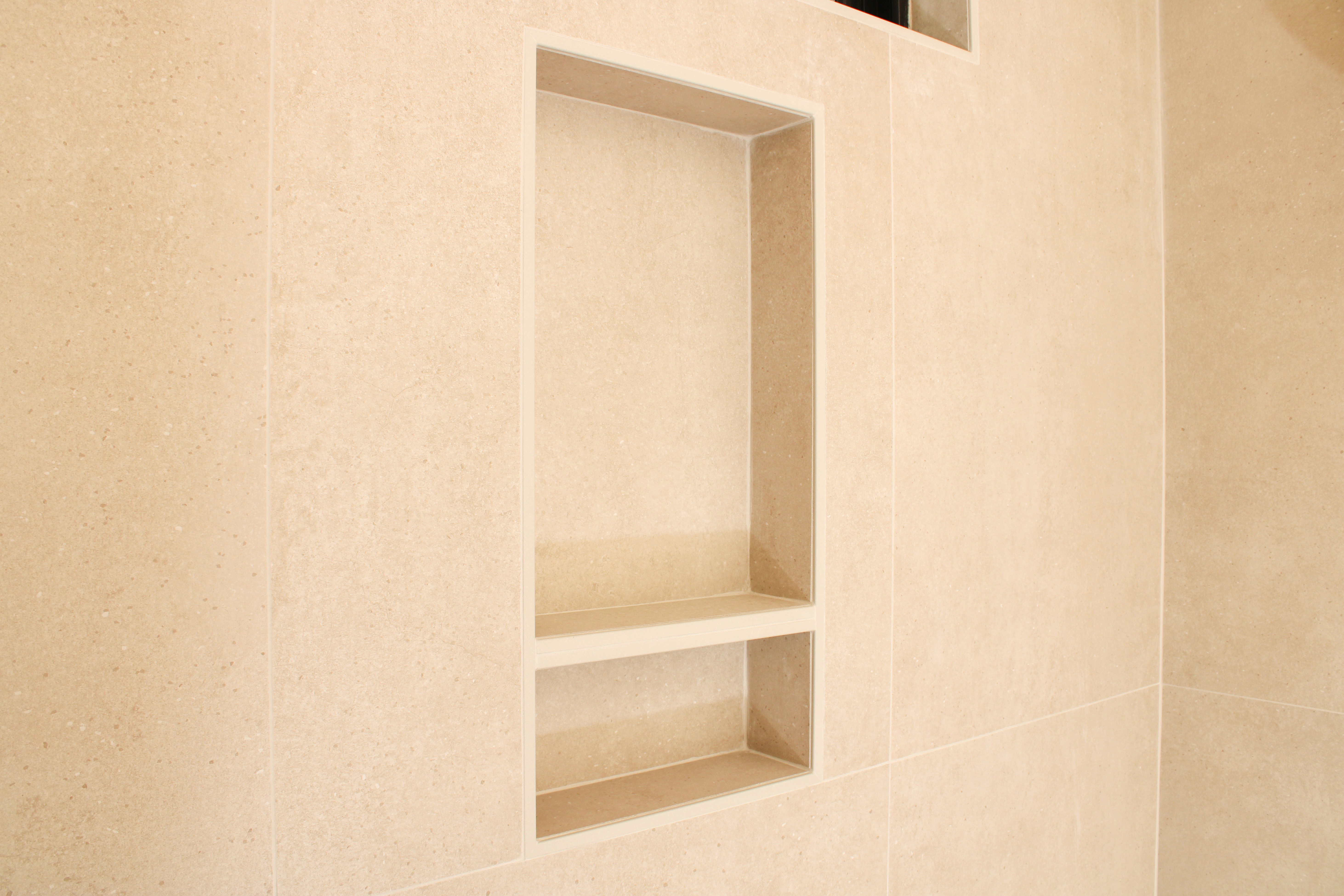 Close-up of tile detailing in remodeled bathroom of a St. George Utah home by Madsen Homes