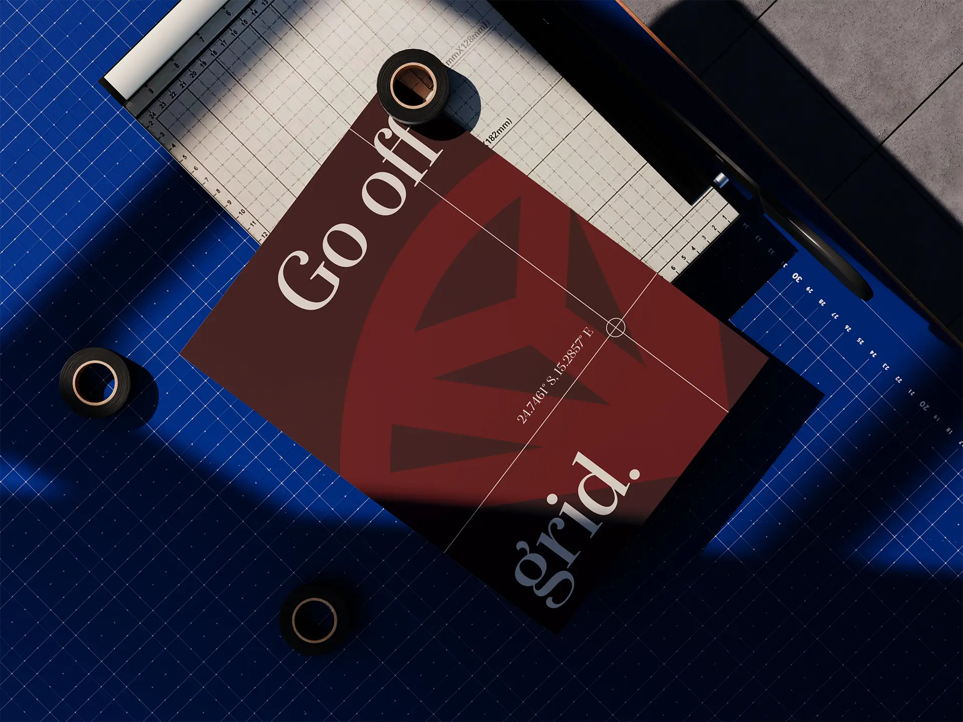 Red card reading Go off grid on a blue cutting mat