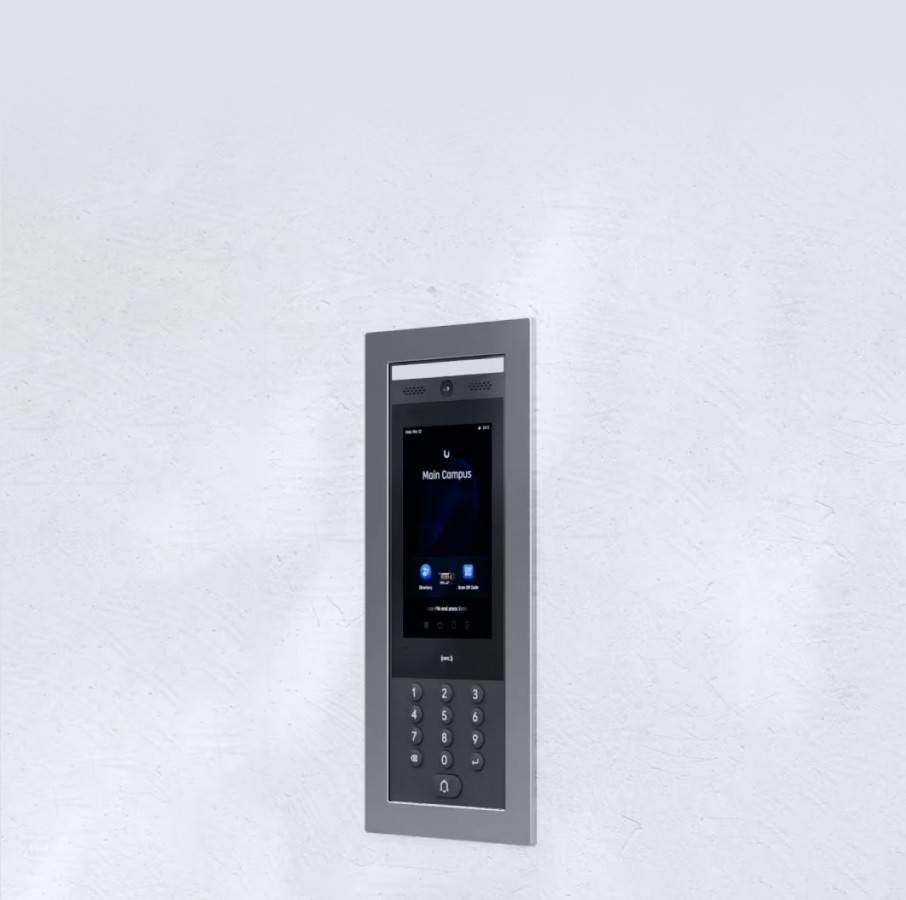 Flush-mounted intercom system with keypad and display, designed for seamless wall installation.
