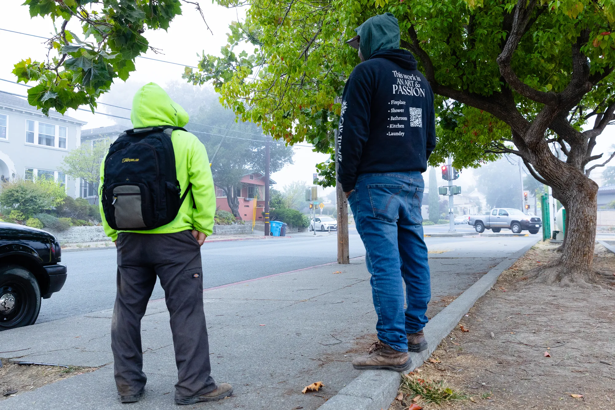 2 Men standing waiting for work 