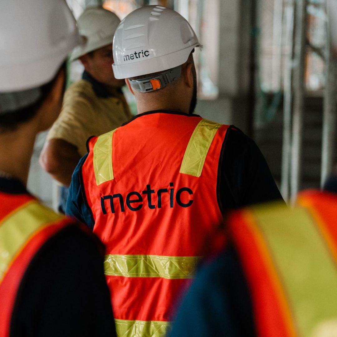 a man sitting in front of a laptop computer