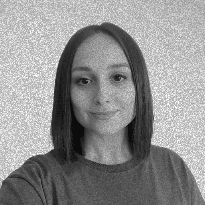 Zoe's profile photo, slightly smiling with short brown hair.