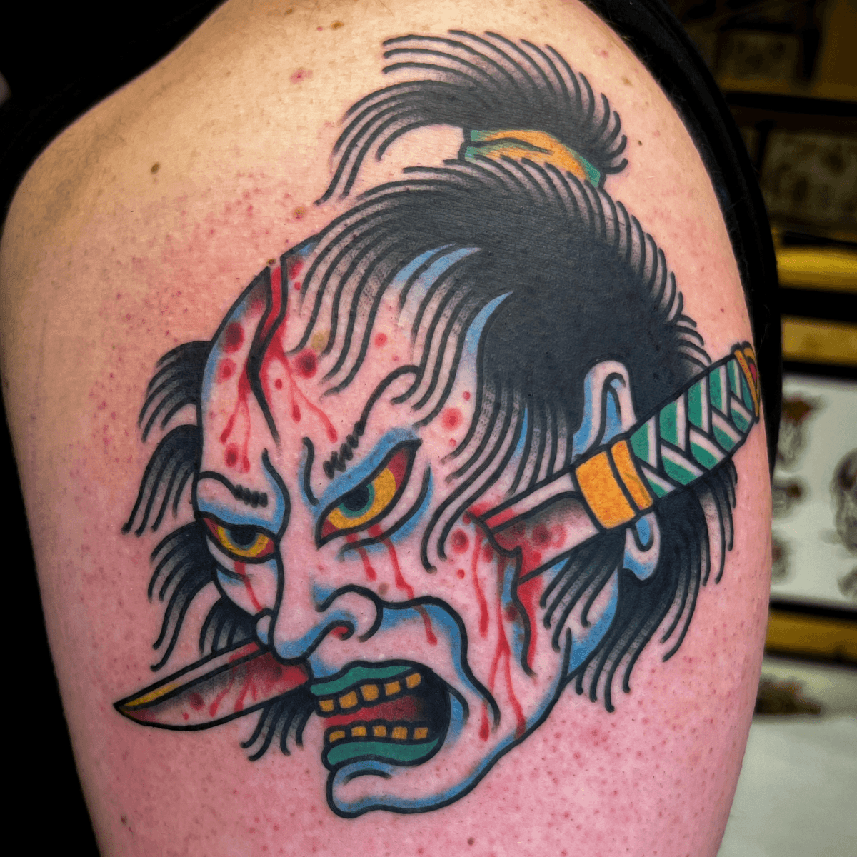 color tattoo of a samurai impaled by a sword 