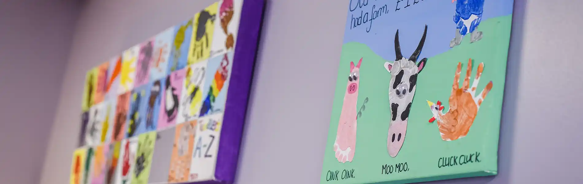 Children's artwork includes a colorful alphabet chart and farm animal paintings with handprints.