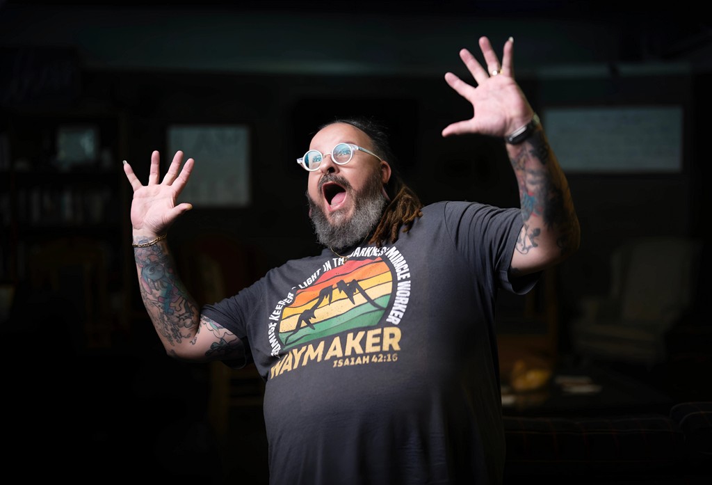 A waterfall surrounded by brown grassy hills