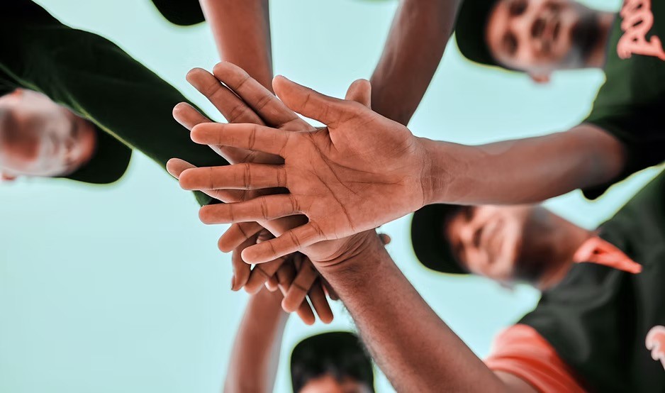 Hands together as a group