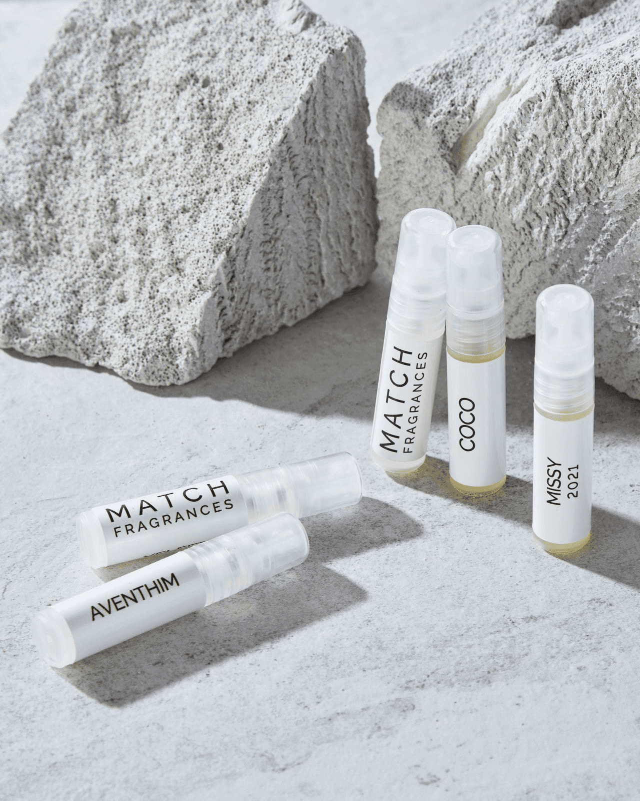 Motocross rider performing a wheelie in a desert