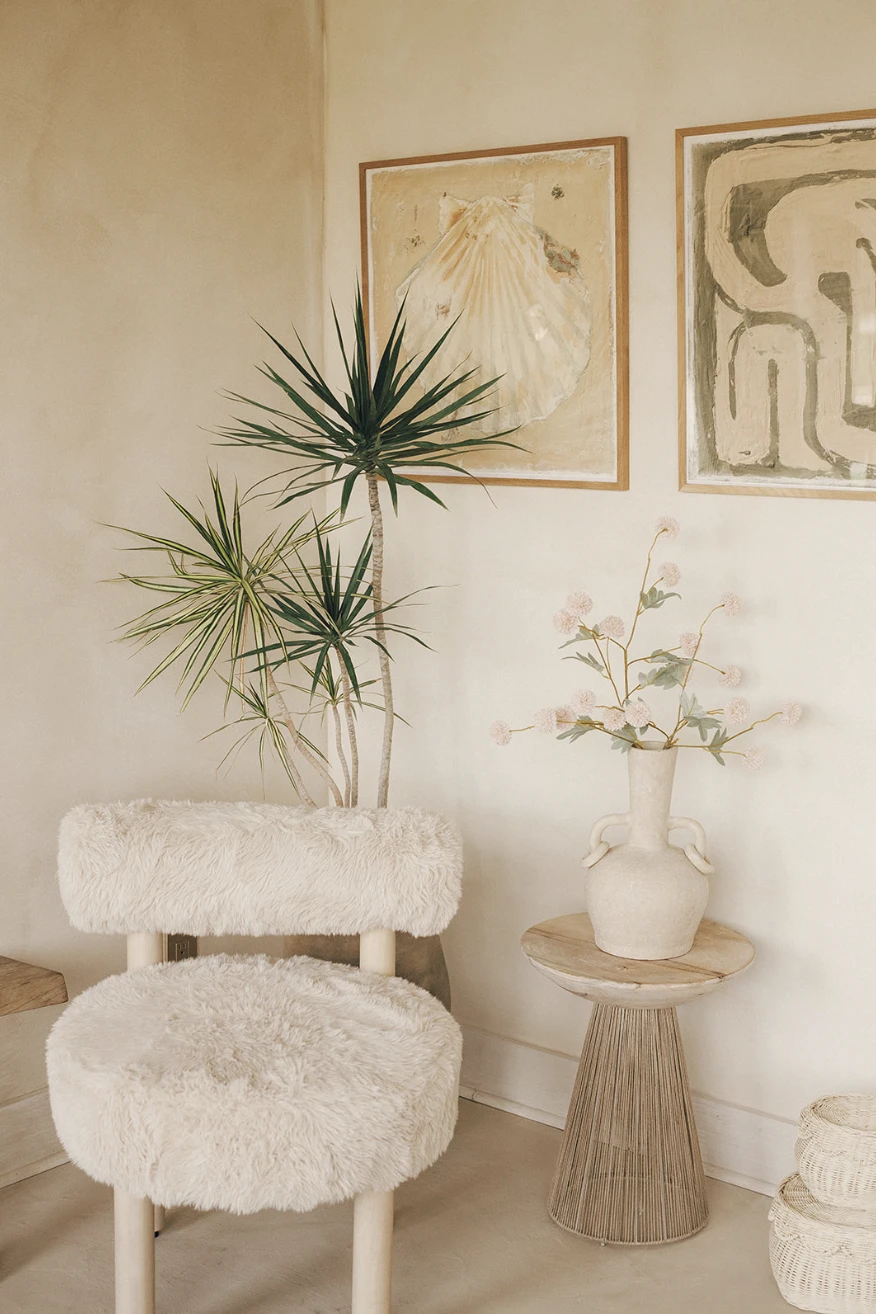 Soft neutral interior details inside Manipura wellness studio featuring natural textures and artwork