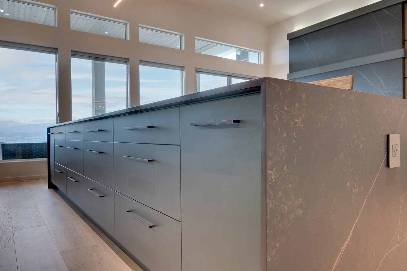 Close-up of kitchen island with waterfall countertop