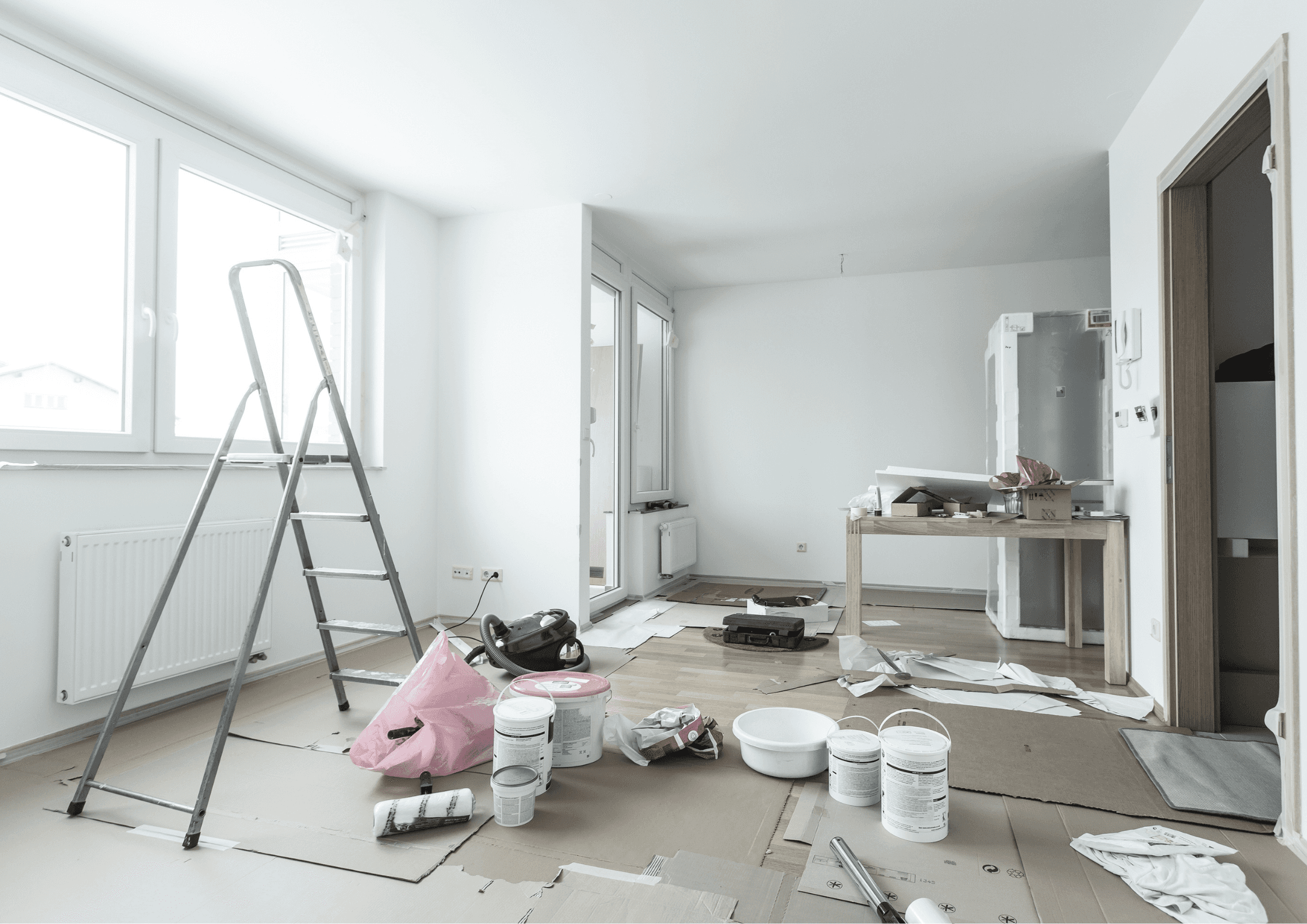 two men looking at a laptop on a table