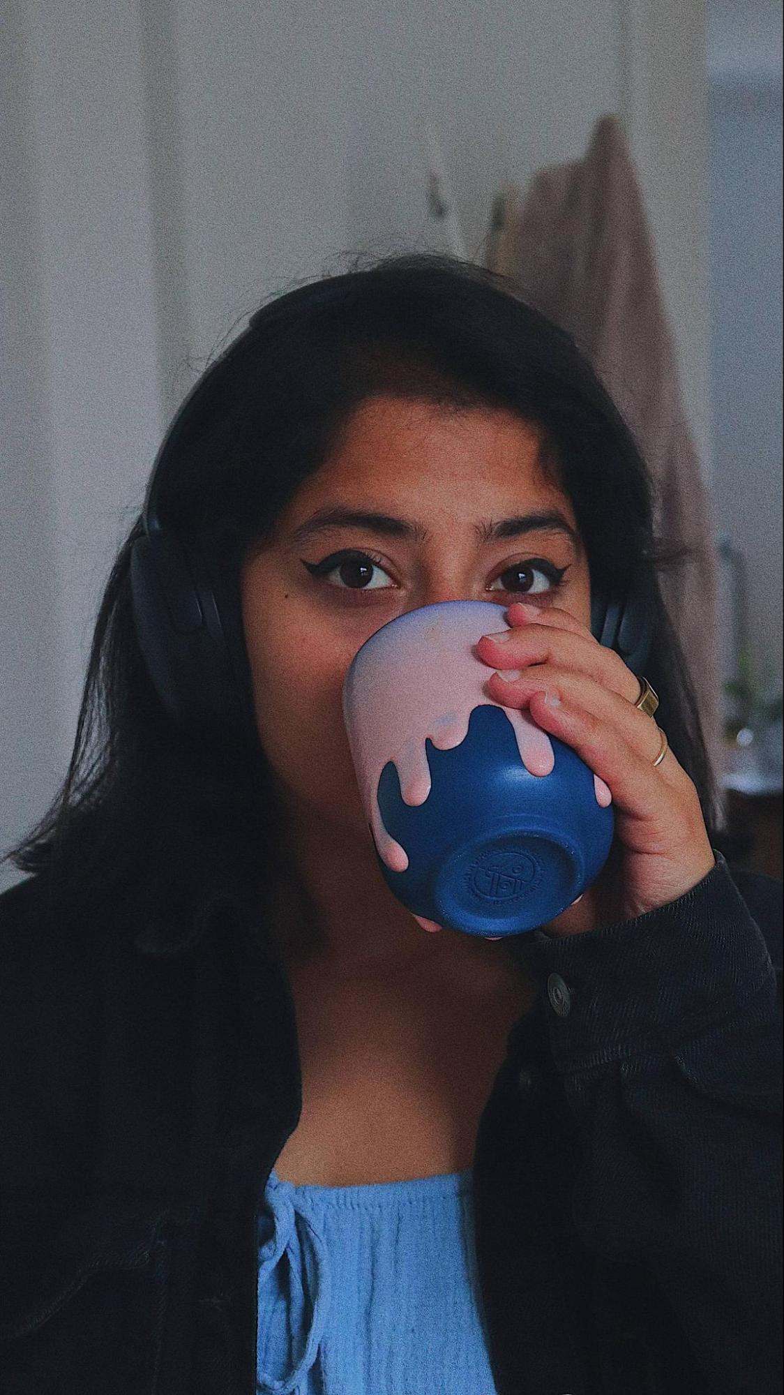 Abstract blue lines and dots on black background.