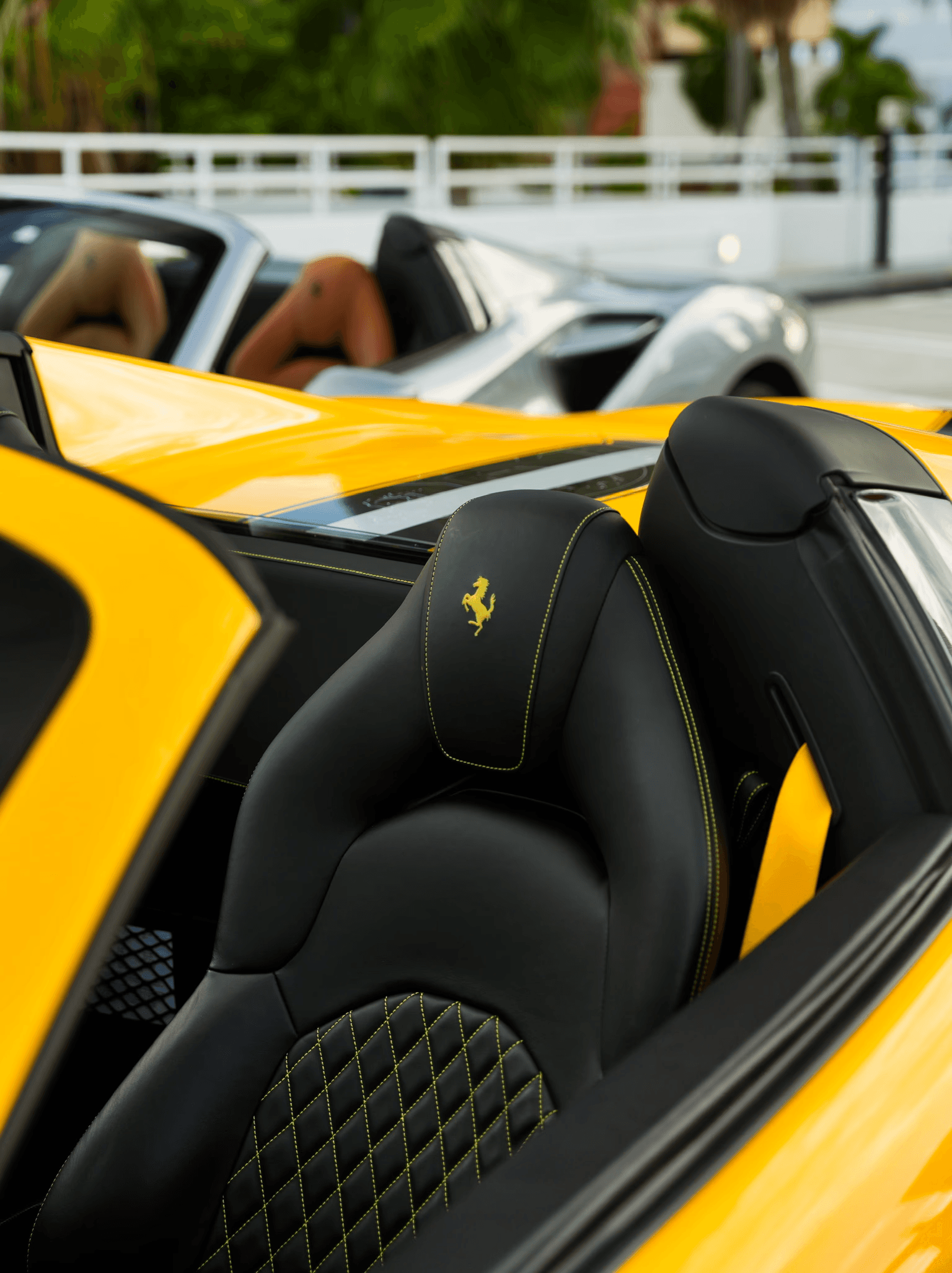 Interior of a car featuring sleek, modern seats, illuminated in a dark setting, emphasizing design and luxury.