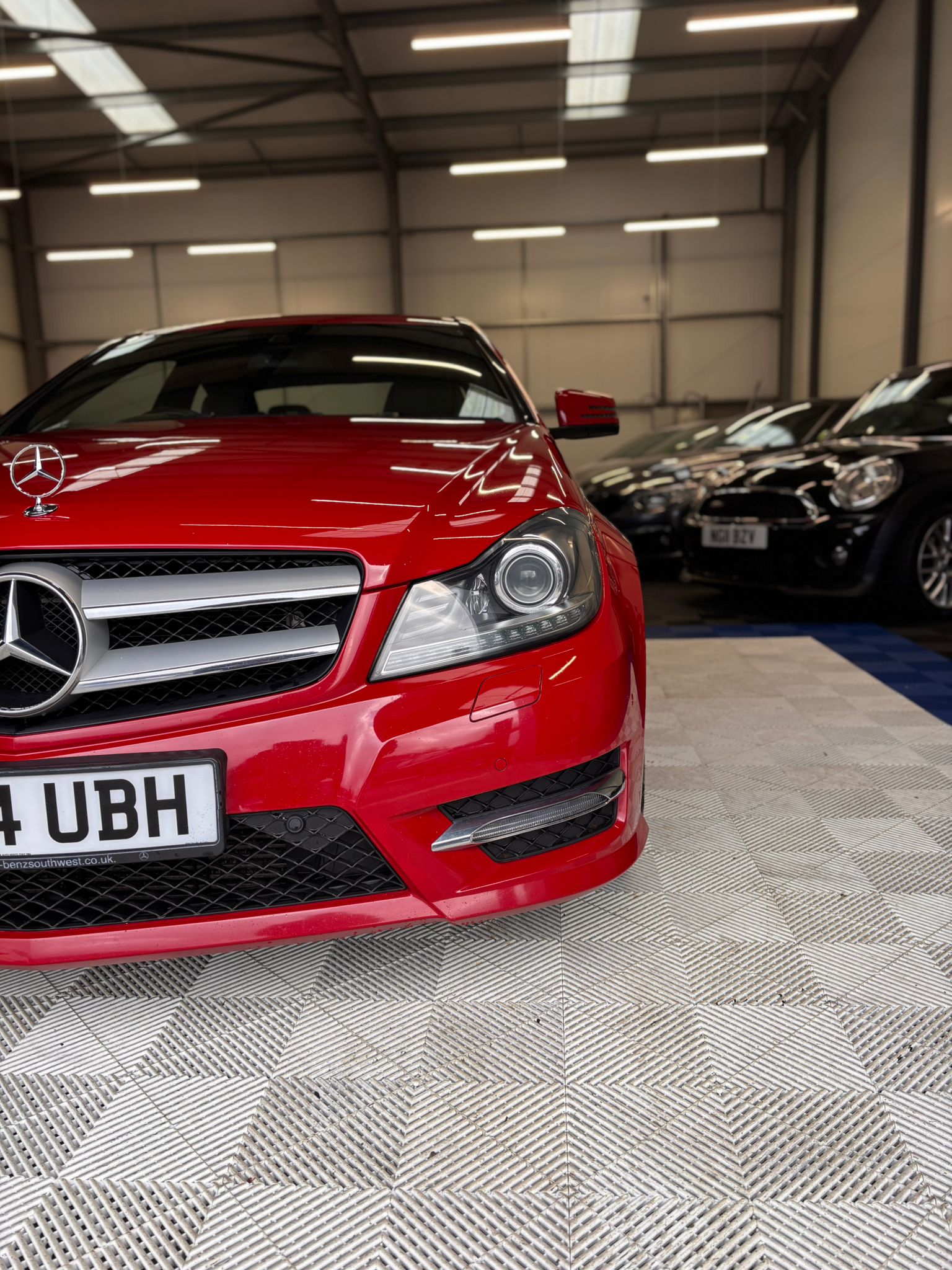 a car is covered in snow in a garage