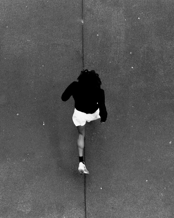 grayscale photo of woman wearing necklace and top