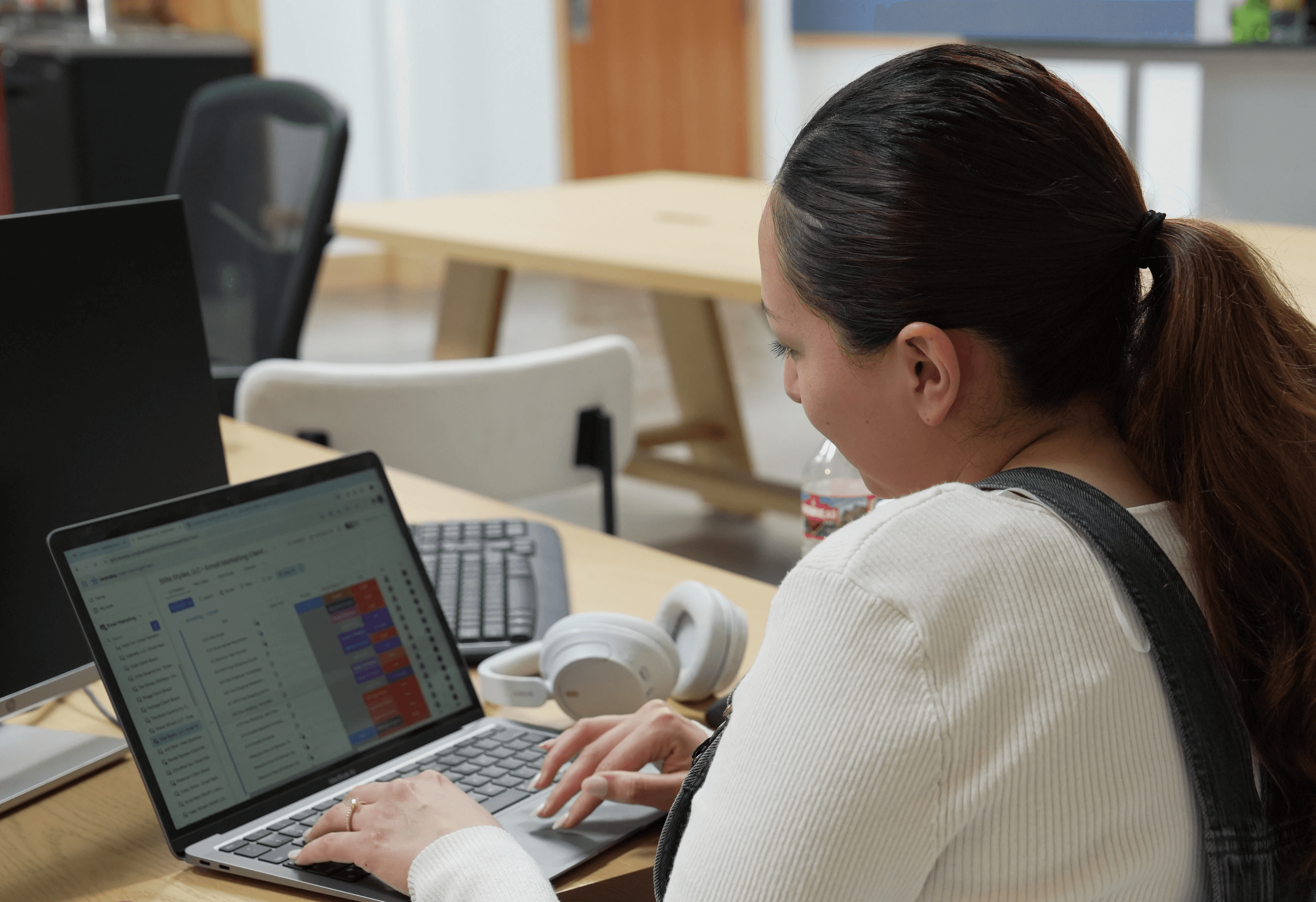 A woman analysing data on an iPad