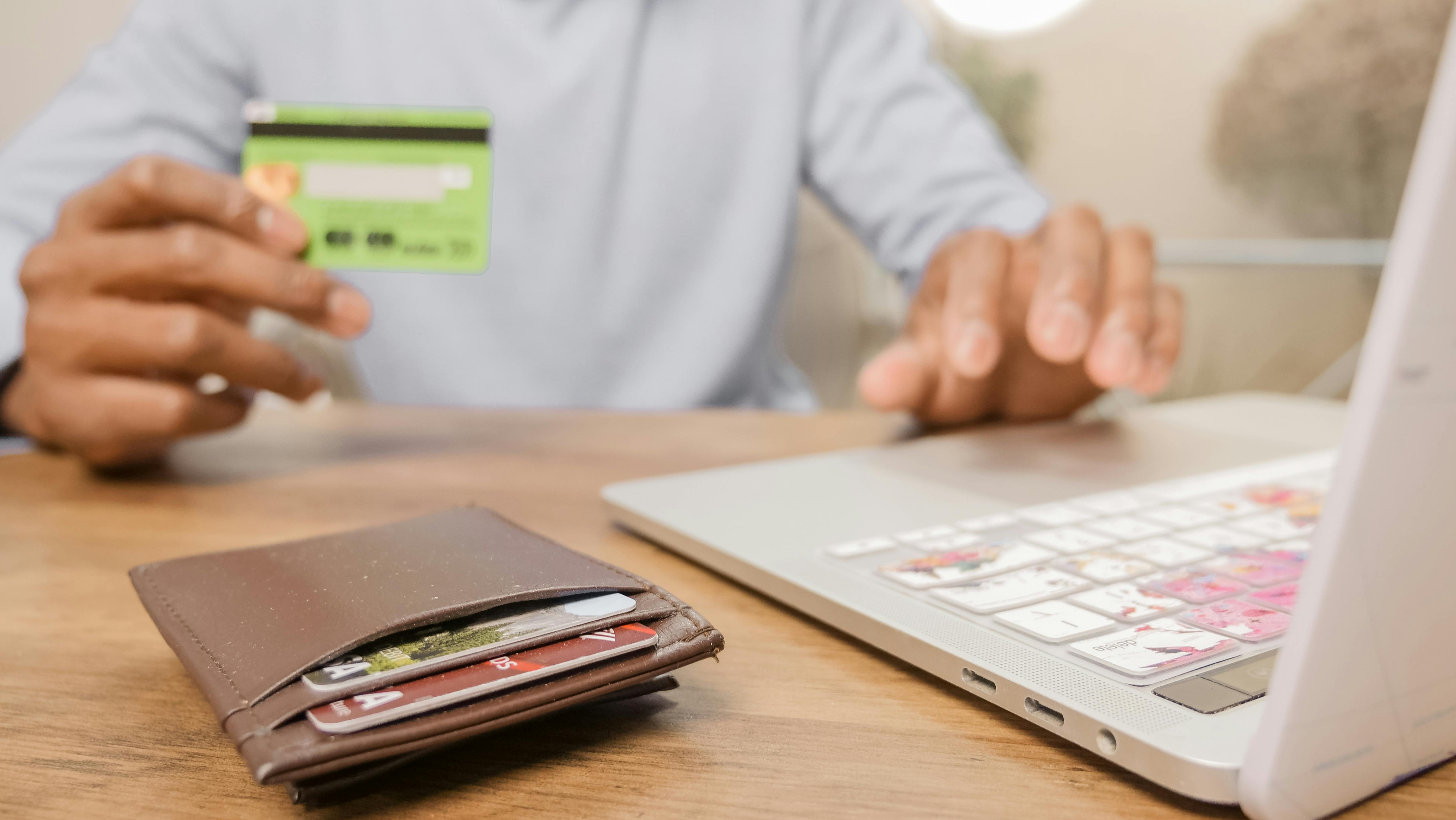 user with a credit card in his hand 