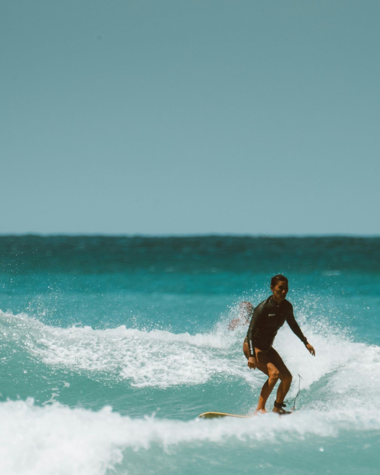 Man surfing on a wave – how-to-read-waves-a-beginner’s-guide-to-catching-better-surf