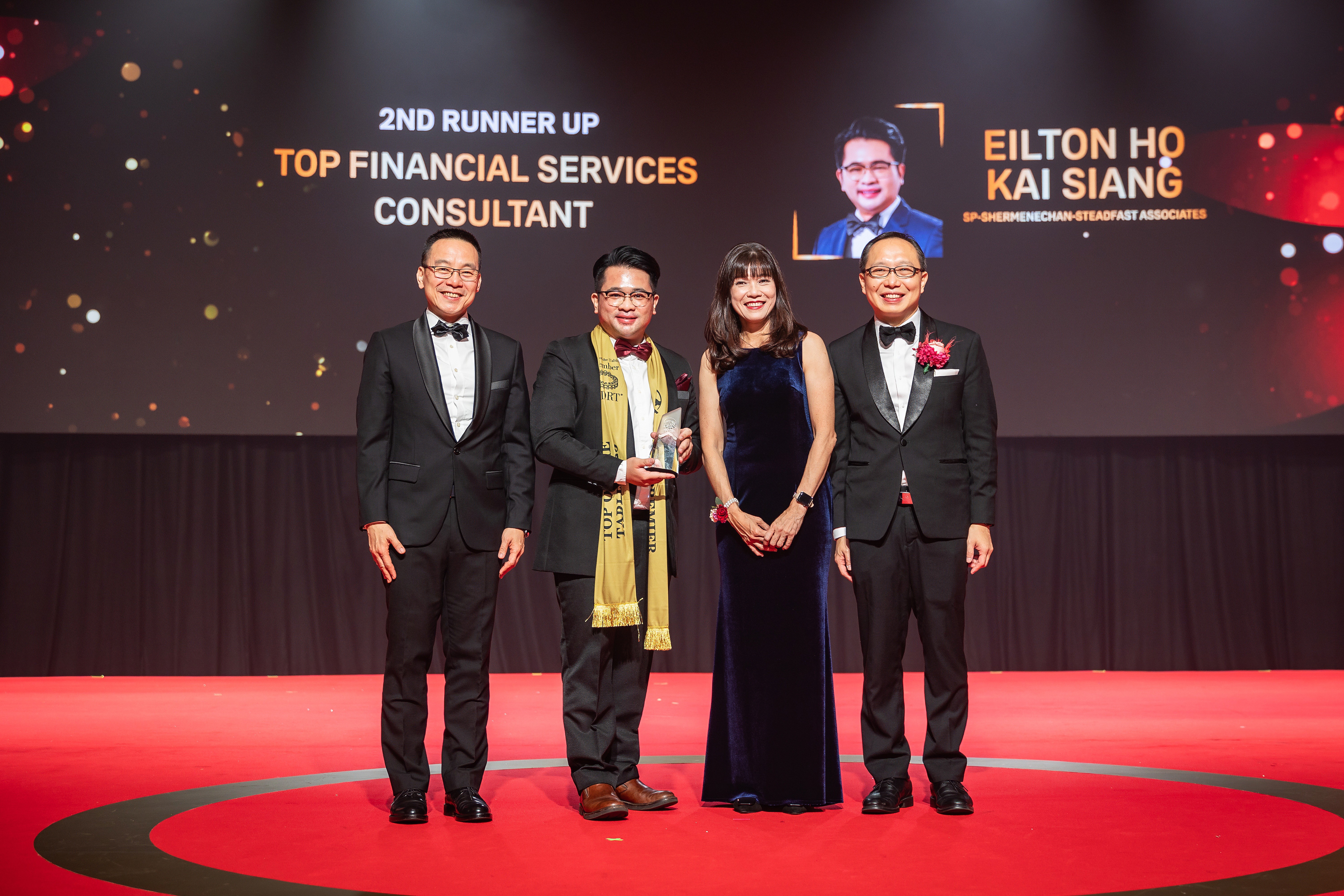 person sitting on grass and using phone